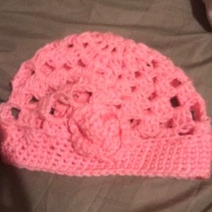 It is a pink hat and cozy to wear for the winter.